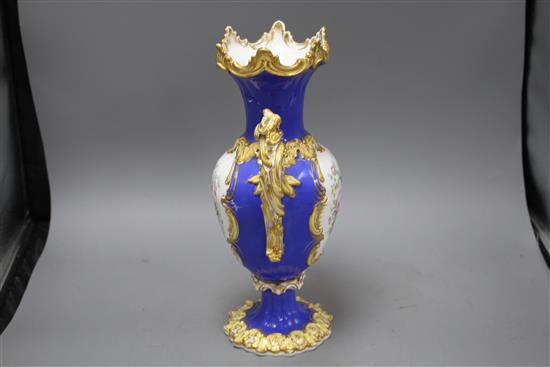 A Victorian porcelain vase, painted with panels of garden flowers, height 35cm